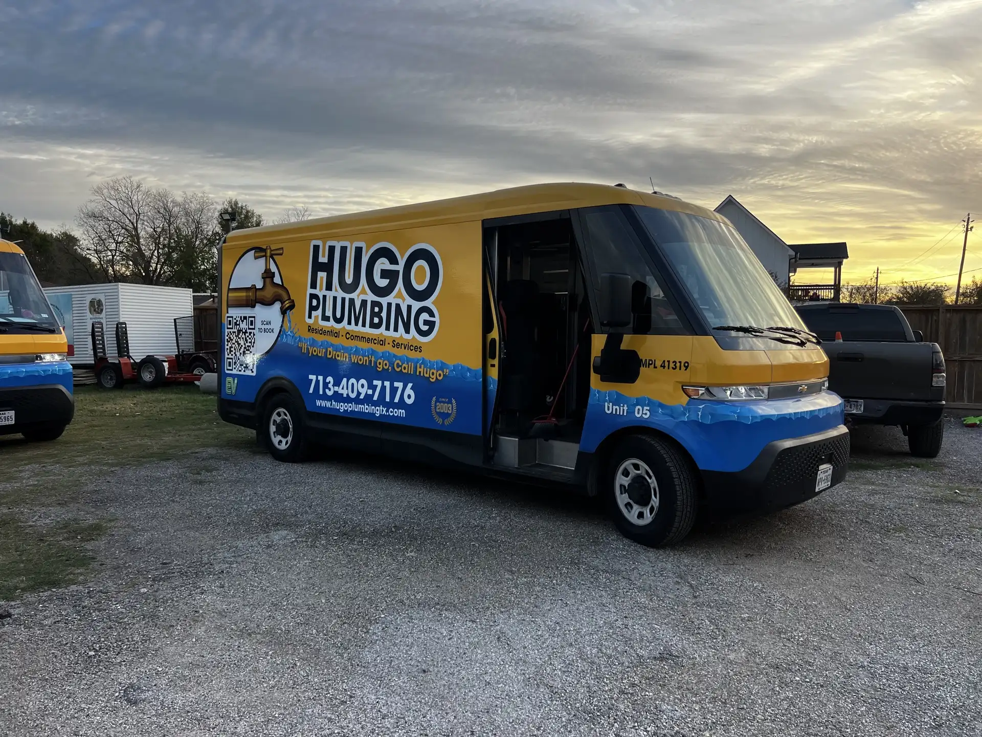 Hugo Plumbing branded service van at sunset in Houston, TX